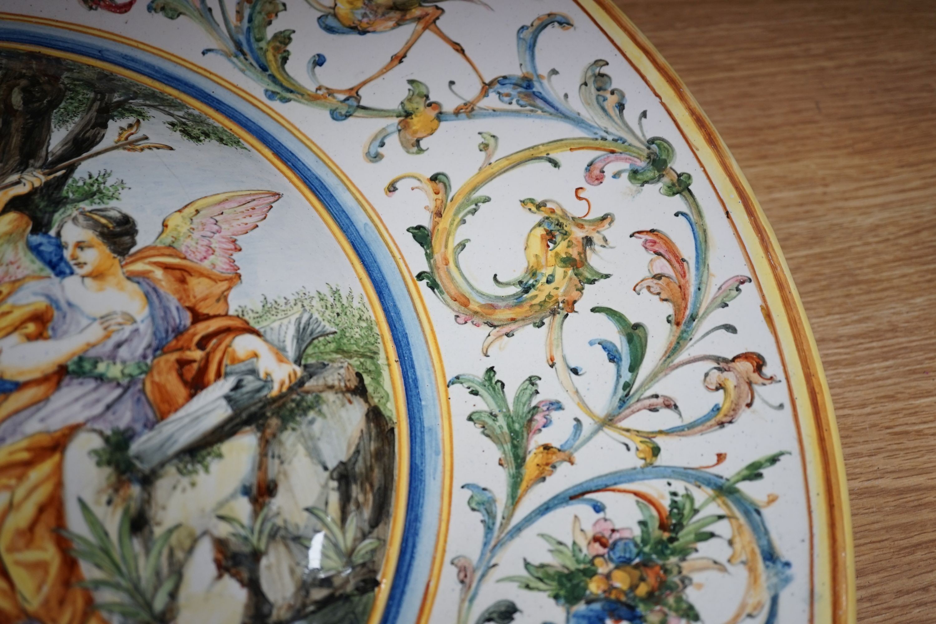 A 19th century large Italian majolica charger, AVF mark, 55cm high.